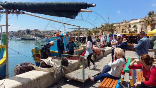 Marsaxlokk, Malta. Fishermen are an important part of the living-heritage of Marsaxlokk and they always attract the curiosity of the visitors (Photo: Jordi Vegas Macias).