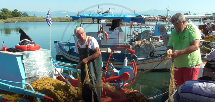 Keramoti lagoon fishing harbour, cleaning the fishing nets, Greece