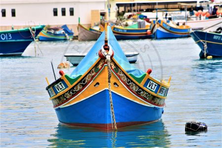 Marsaxlokk, Malta. The unmistakable colors of the Luzzu are normally composed of deep marine blue, a terracotta red and a pastel yellow interspersed with streaks of white and green. All natural colors represent the land, the sea, the sun and the green fields. It is said that the colors helped to identify the Maltese fleet from other competitors or enemies while fishing. The other characteristic are the eyes, which may be the modern survival of an ancient Phoenician custom by the ancient Greeks and Egyptians. They are referred to as, the Eye of Horus or of Osiris, symbol of protection, good health and said to protect the fishermen while at sea. (Photo: Jordi Vegas Macias)
